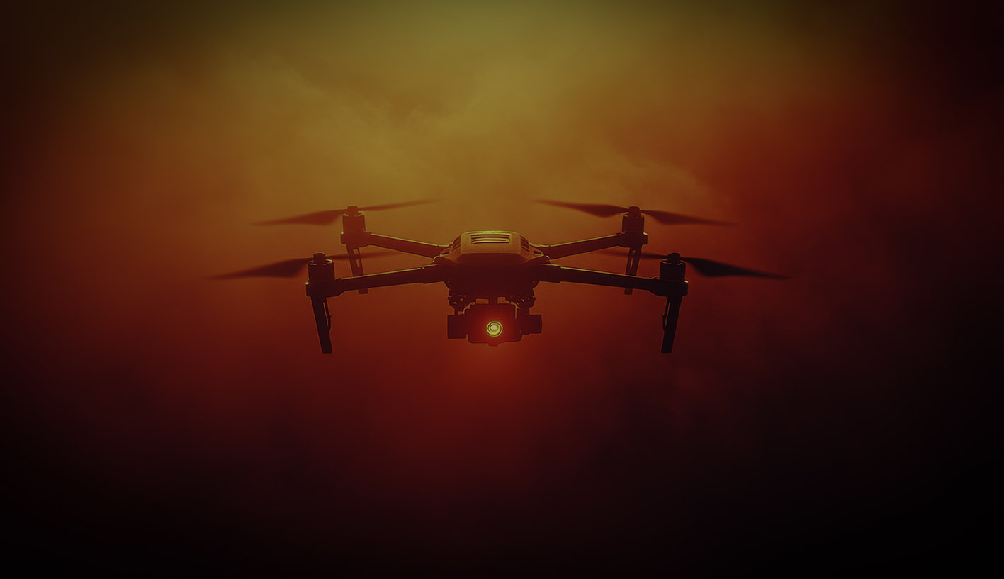 Drone silhouette against a dramatic orange sky, used in the Eye Watch Security corporate profile's visual direction.