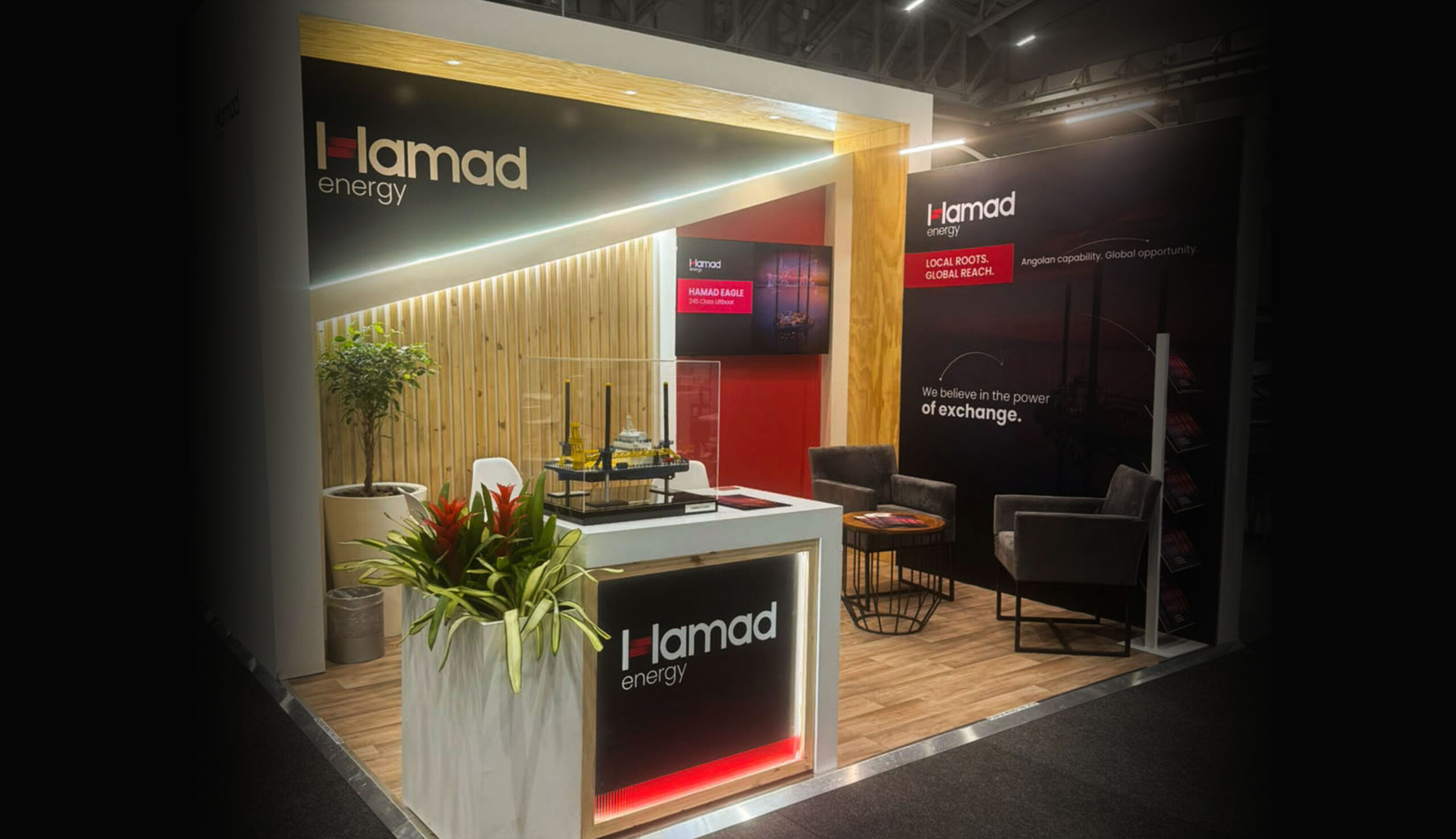 Hamad Energy exhibition stand at African Energy Week 2026 in Cape Town, featuring branded graphics, digital display and Hamad Eagle model.
