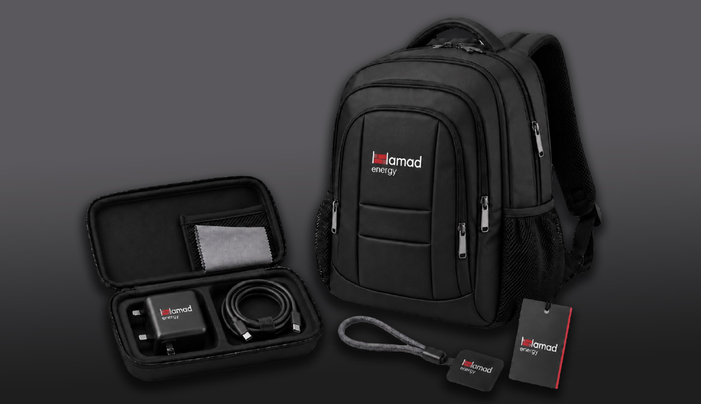 Hamad Energy branded corporate gift selection featuring a business backpack, technology accessories and presentation packaging.